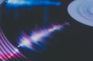 Vinyl record spinning in dark moody atmospheric music photography