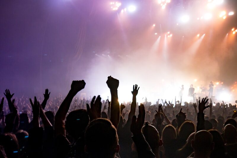 Illustrative concert stage image representing Sleep Token's lead singer Vessel in performance